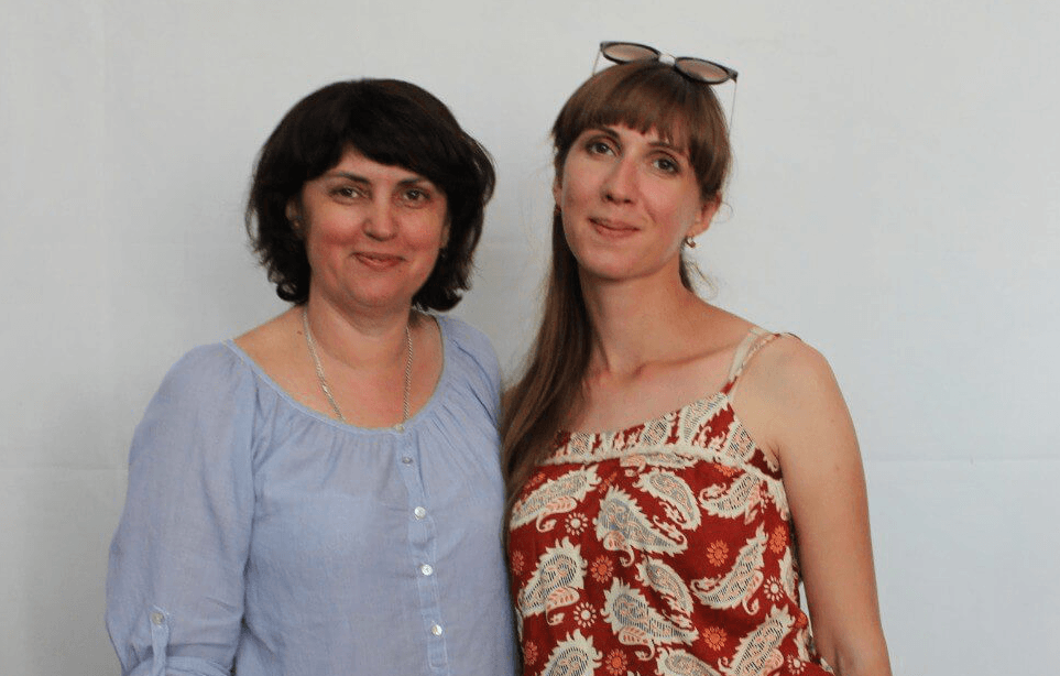 Lyuba and Anzhela, volunteers at Life Center Zaporizhzhia, walking alongside each other during a difficult season.